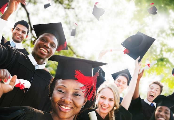 career college graduates celebrating at their graduation